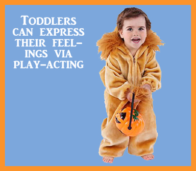 Toddler play acting. Little girl dressed up as a lion.