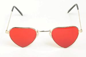 Looking at your child with positive parenting sunglasses. Funny sunglasses with heart shaped red glass