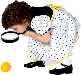 Little girl with magnigfying glass.